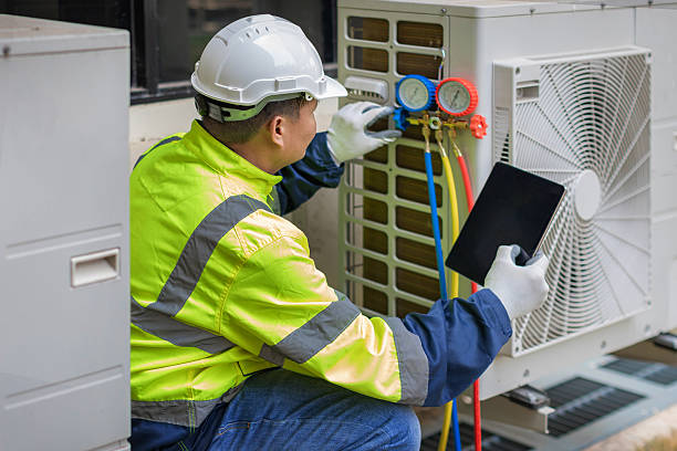 Professional Heat Pump Repair technician working in Dewey, OK